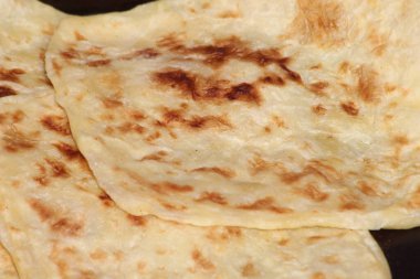 A close-up of the traditional Moroccan flatbread known as Msemmen or Msemen clipart