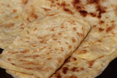 A close-up of the traditional Moroccan flatbread known as Msemmen or Msemen clipart