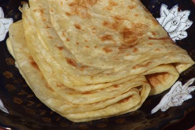 A close-up of the traditional Moroccan flatbread known as Msemmen or Msemen clipart