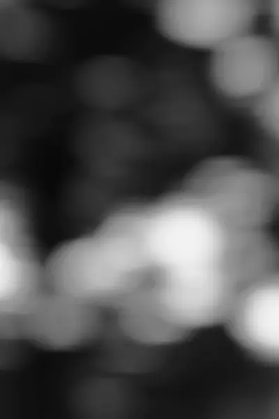 Tek renkli bir palette bulanık ışıkların soyut bir görüntüsü, çeşitli tasarım uygulamaları için rüya gibi ve ruhani bir kalite yaratıyor.