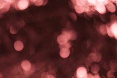 Güzel kestane rengi bokeh ışıkları şenlikli kutlamalar ve tasarım projeleri için soyut ve rüya gibi bir zemin oluşturur. Duvar kağıtları, kaplamalar ve sihirli efektler için ideal