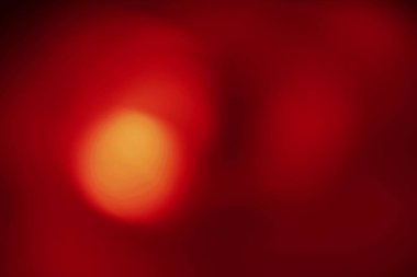 Kırmızı ve altın renkli bulanık bir arkaplan. Sevgililer Günü ya da şenlikli tasarımlar için ideal.