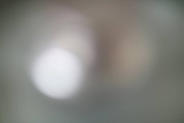 Yumuşak ışık bokeh ve ince eğim dokusu ile soyut bulanık arkaplan. Modern tasarım projeleri veya rüya gibi arka planlar için ideal