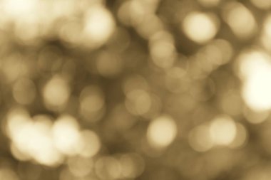 Nazik bir sepia bokeh, huzurlu ve soyut bir sahne yaratır. Huzurlu bir estetik için ışığı yumuşak, parıldayan kürelere dönüştürür..