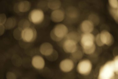 Sanatsal kaplama veya arkaplan için ideal rüya gibi estetik arkaplana sahip yumuşak kahverengi bokeh arkaplanı