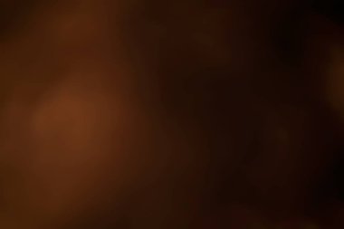 Amber, yumuşak bir parıltıyla soyut bir arkaplan oluşturarak bulanık, eski bir doku yaratıyor.