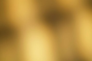 Daha koyu tonlarda yumuşak, bulanık dokusu olan soyut altın eğimli arkaplan