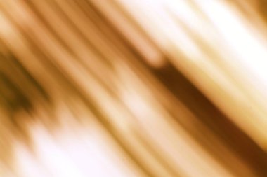 Kahverengi ve beyaz tonlarda soyut hareket, akış ve enerji uyandırır.