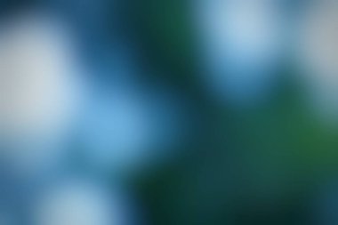 Sakinleştirici etki için mavi ve yeşili harmanlayan soyut gradyan arkaplan