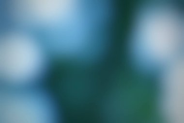 Mavi ve yeşilin hassas bir karışımı sakin ve soyut bir arkaplan oluşturur