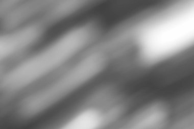 Bulanık gri tonlu arka plan yumuşak köşegen ışık çizgileri ve ince gölge eğimleri içeriyor. Minimalist tasarım arka planlar, dijital sanat veya üst üste gelen elementler için idealdir. Bir sükunet yaratır,