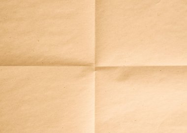 Kalıplı kahverengi kağıt yüzey, sanatsal projeler, arka planlar veya ambalaj amaçları için ideal kıvrımlar ve kıvrımlar sergiler, sıcak ve doğal bir atmosfer yaratır..