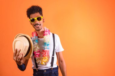 Carnival Outfit Party. Portrait of Black Man With Carnival Props Having Fun,  Isolated on Orange Background