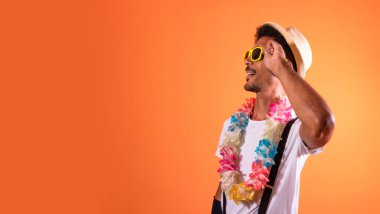 Carnival Brazilian Outfit. Black Man With Carnival Costume Having Fun,  Isolated on Orange Background