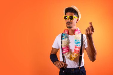 Carnival Brazilian Outfit. Black Man With Carnival Costume Having Fun,  Isolated on Orange Background