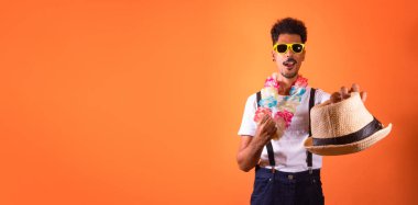Carnival Brazilian Outfit. Black Man With Carnival Costume Having Fun,  Isolated on Orange Background