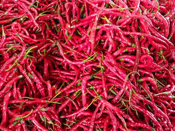 Bir sürü Cabe Merah ya da markette satılık kırmızı biber. Kırmızı biber arka plan deseni.