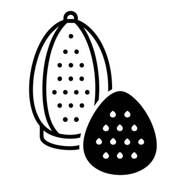 Whole Nutmeg with a Grater and a Small Mound of Ground Nutmeg Vector Illustration Design clipart