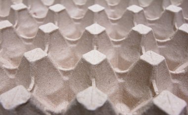 Boş kağıt yumurta tepsisi açı açısı, doku ya da arka plan. Karton yumurta tepsisinin arka planını kapatın. Seçici odak.