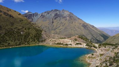 Salkantay Mountain Hike, with the lagoon Humantay and a river in Peru clipart