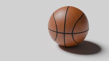 Basketbol yumuşak bir yüzeyde oturur, yumuşak bir gölge bırakır. Ayrıntılı dokusu ve tasarımı belirgin bir şekilde gösterilir ve bu sporun tipik kahverengi deri ve siyah çizgileri vurgulanır..