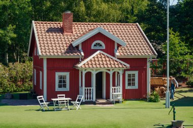 VIMMERBY, SWEDEN - 14 June 2023: Theme park Astrid Lindgren's World, Emil's of Lonneberga house. clipart