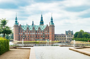View of Frederiksborg castle with park in Hillerod, Denmark clipart
