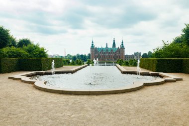 View of Frederiksborg castle with park in Hillerod, Denmark clipart