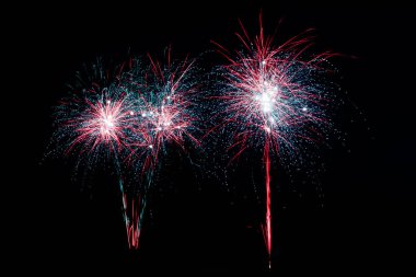 Colorful fireworks lights on the night sky background clipart