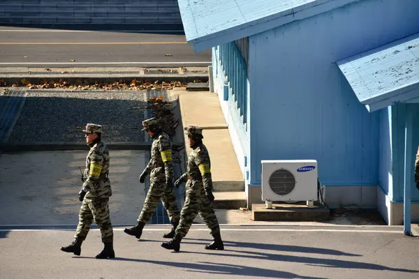 stock image Panmunjom, North Korea - December 26 2018: North Korean soldiers patrol the DMZ between North and South Korea.