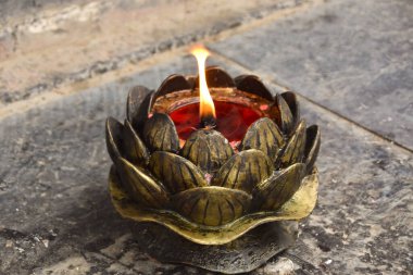 The flickering flame of a candle at the Shaolin Temple clipart