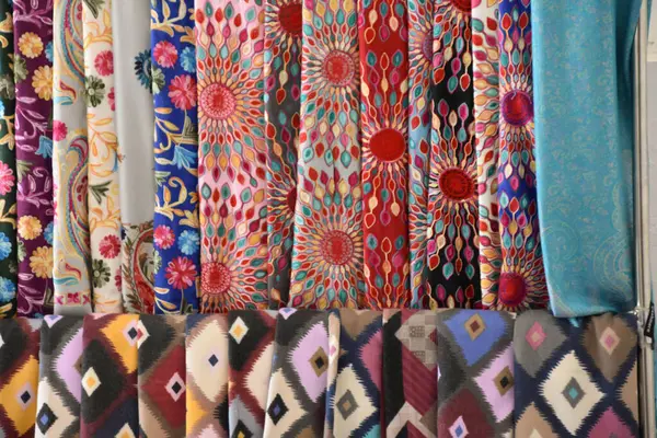 stock image Colourful scarves for sale at a market stall in the Samarkand bazaar