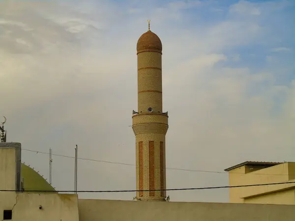 stock image A minaret rises above rooftops in Erbil, Iraq