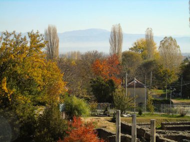 View of Trees and Roman Ruins at Heraclea Lyncestis in Macedonia in Autumn clipart