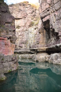 View of Blue Pool and Sandstone Walls of the Canyon at Yuntaishan in Henan Province, China clipart