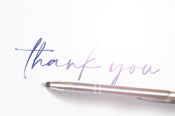 Hand writing thank you on piece of old grunge paper