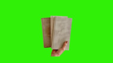 Elinde bir kitap tutarken kağıt katlama durdurma hareketi Yeşil Ekran