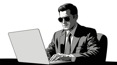 Güneş gözlüklü bir iş adamı profesyonel bir ortamda özenle dizüstü bilgisayar üzerinde çalışıyor.