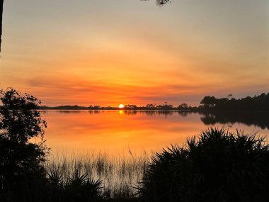 Sunset at dune lake in Florida clipart