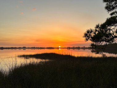 Lake sunset reflection, Dune lake Florida clipart