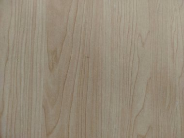 Hafif ahşap yüzey yumuşak bej ve kahverengi renkte doğal tahıl desenleri sergiliyor.