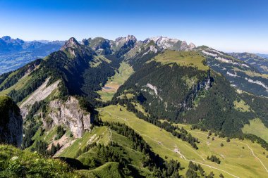 beautiful view on the mountains Hoher Kasten and a small village in the swiss alps, switzerland