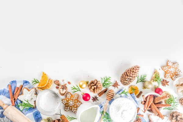 stock image Christmas baking background. Christmas sweet cooking ingredients on white table. Ingredient for cooking christmas pastry, cookies and cakes, Flatlay on white table, top view with copy space