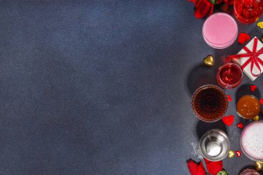 Valentine day romantic bar background. Set various red, pink, chocolate alcohol drinks for Valentine day party or dating, in different cocktail glasses with rose flower bouquet, heart decor, gift box