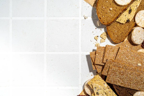 Gluten free allergic diet, celiac disease concept. Collection of various non-gluten different bread, whole grain loaves. Healthy alternative to bread, flatlay copy space