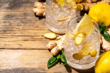 Refreshment Ginger Ale cocktail, Kombucha or Lemon Ginger iced lemonade drink. Sweet and sour alcohol drink copy space