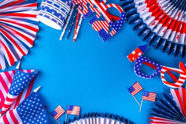 Happy Labor Day, Presidents Day, Fourth of July Independent Day, Memorial day, Columbus day background. Blue background with USA flag color paper fans and decorations, party accessories