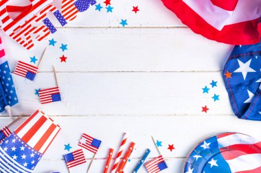 Happy Labor Day, Presidents Day, Fourth of July Independent Day, Memorial day, Columbus day background. White wooden background with USA flag color paper fans and decorations, party accessories