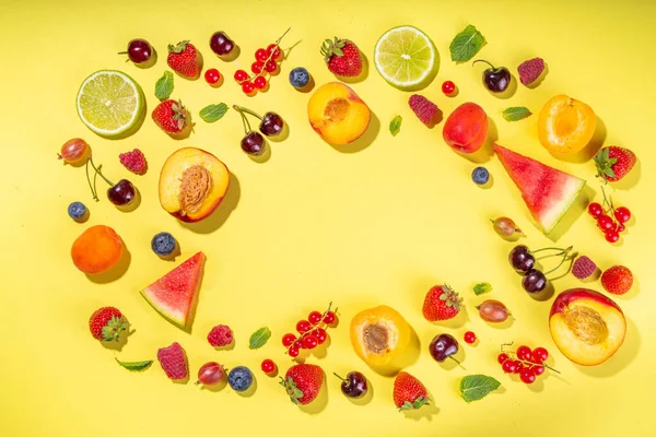 stock image Summer vitamin food concept, various fruit and berries watermelon peach mint plum apricots blueberry strawberry currant, creative flat lay on yellow background top view copy space