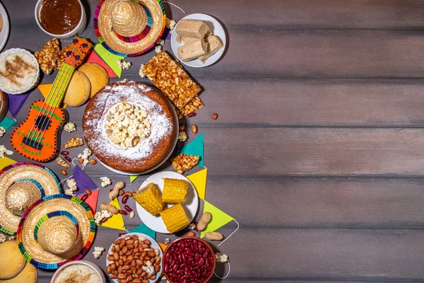 stock image Traditional Festa Junina Summer Festival Carnival Food. Traditional Brazilian Festa Junina dishes and snacks - popcorn, peanuts, corn cake,beans, cookie, pacoca, with holiday decor and accessories